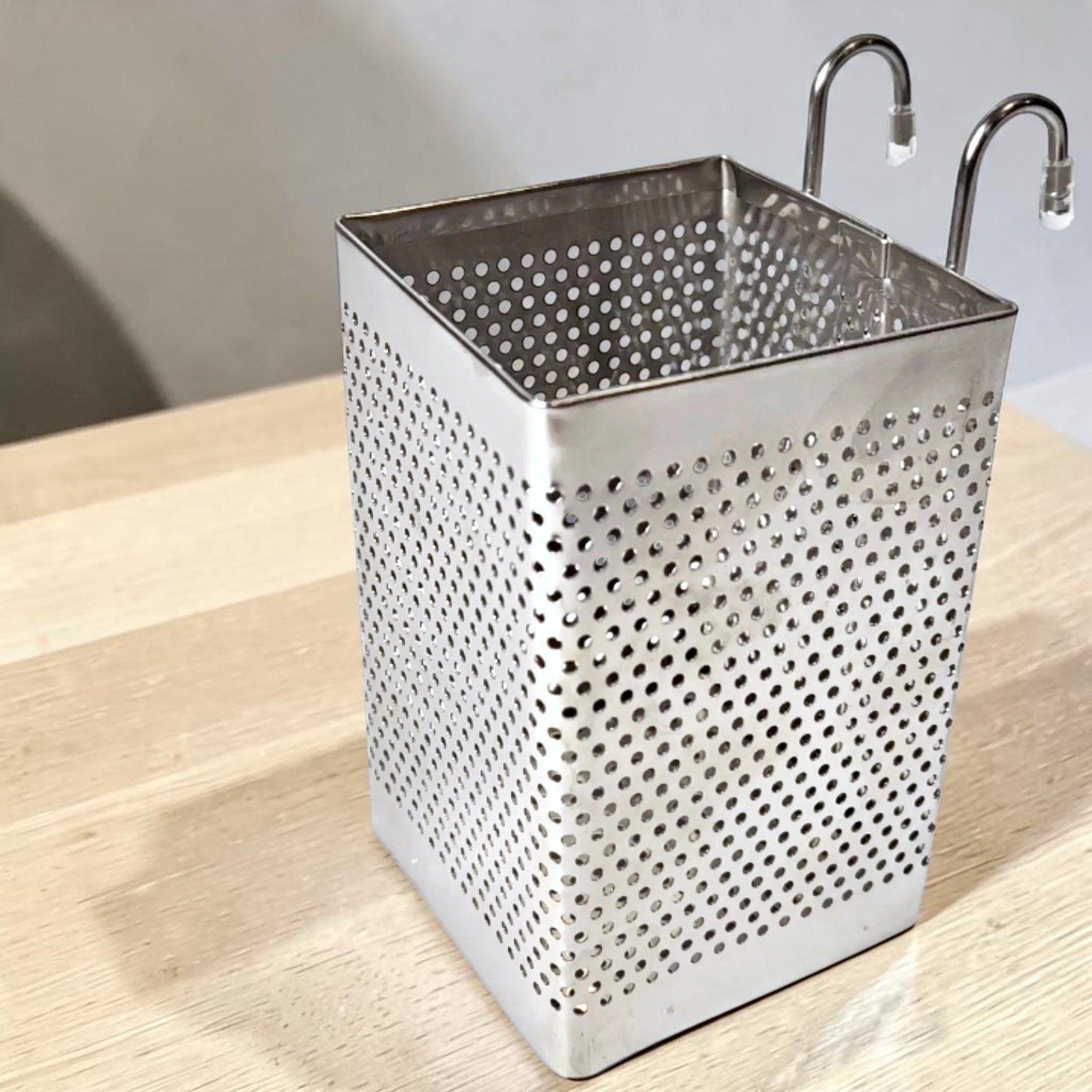 VIKROM dishwasher basket on a wooden surface